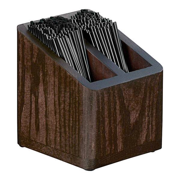 A dark oak wood holder with metal rods in it.