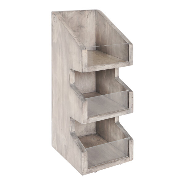 A Cal-Mil gray-washed pine wood condiment organizer with three clear plastic trays on wood shelves.