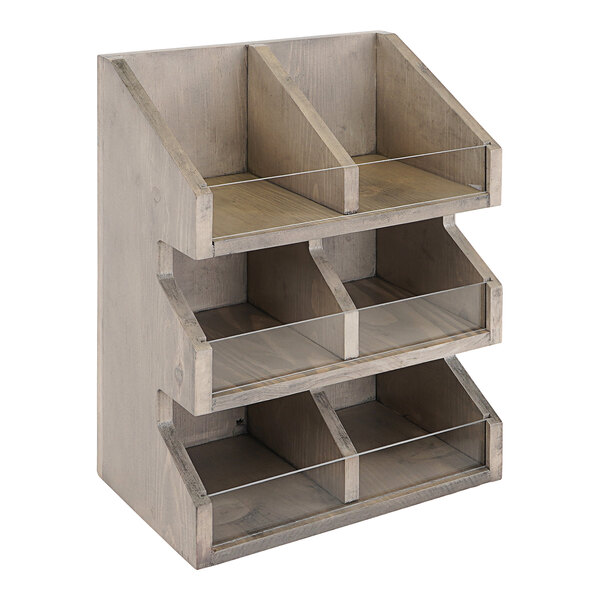 A gray-washed pine wood condiment organizer with 3 tiers and 6 sections.