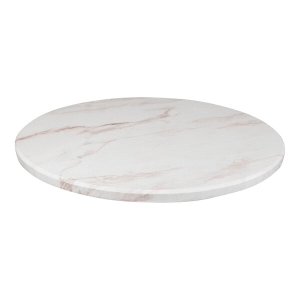 A white marble table top with pink veins.