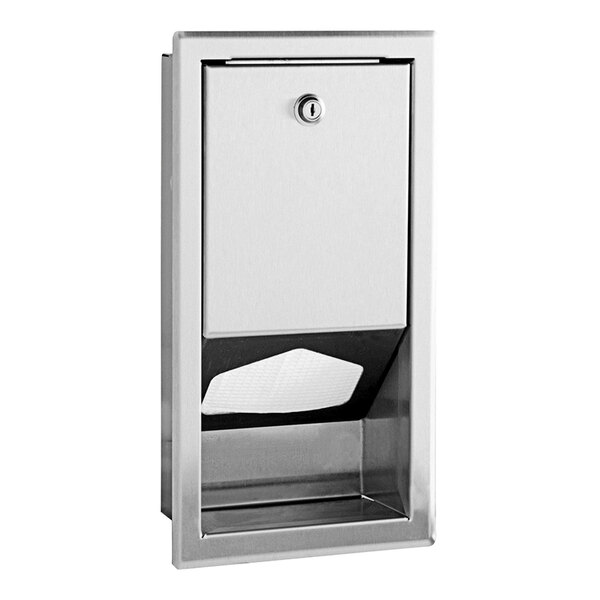 A white stainless steel recessed liner dispenser with a door.