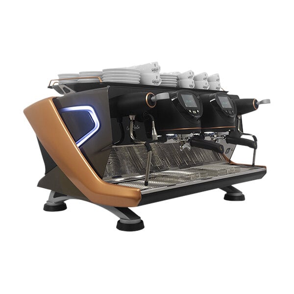 A close-up of a Gaggia La Reale espresso machine with white cups on top.