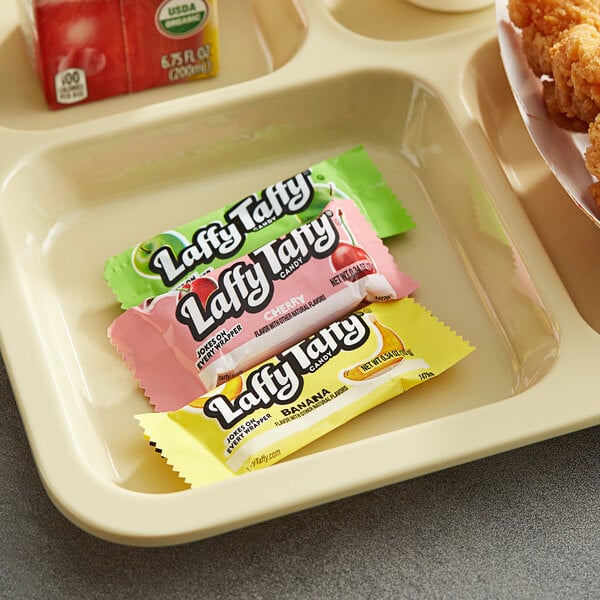 A red tray of Laffy Taffy Mini Assortment on a table.