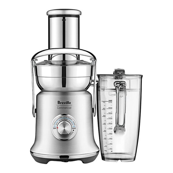 A Breville silver juicer with a glass cup.