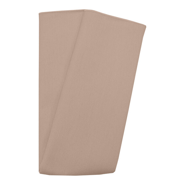 A folded Snap Drape Sandalwood cloth napkin on a white background.