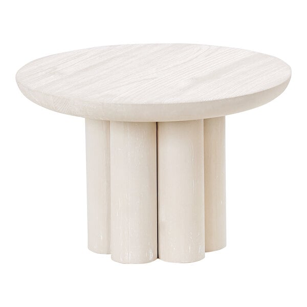 A white round table with a white-washed pine wood display riser on top.