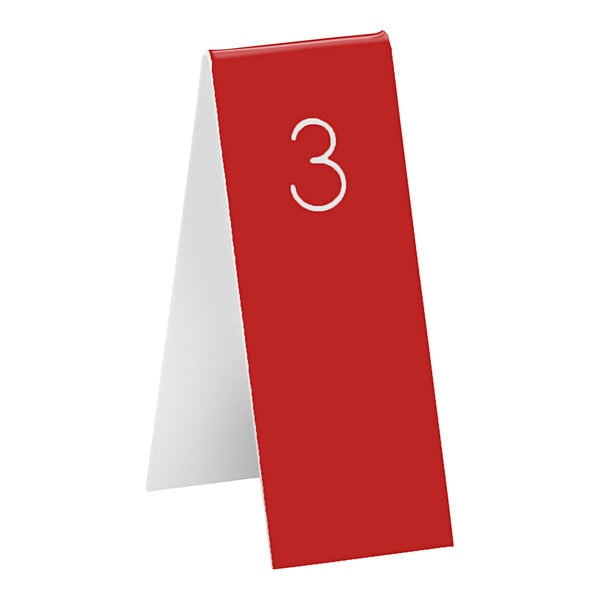 A red Cal-Mil table number tent with the number three in white.