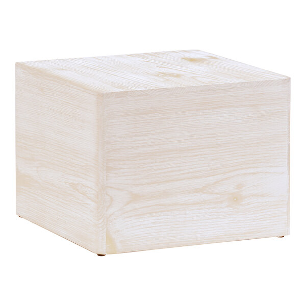 A white wooden cube display riser.