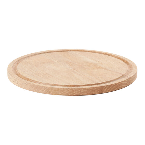 A round oak wood serving board with a circular edge.