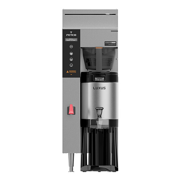 A Fetco CBS-1241 Plus series automatic coffee maker with black and silver trim.