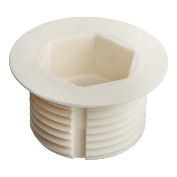 A white plastic square drain plug with a hole in it.