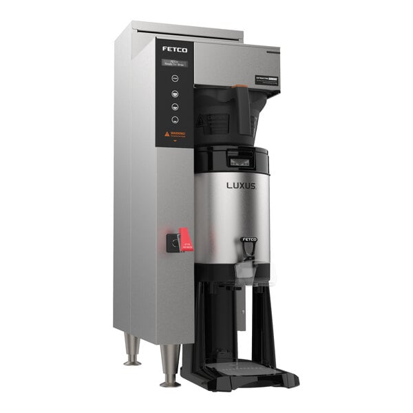 A Fetco CBS-1251 Plus automatic coffee brewer with a stainless steel base and black lid.