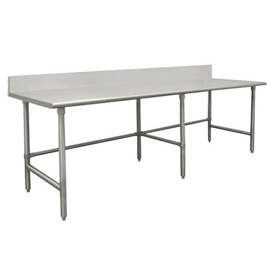 A close-up of an Advance Tabco stainless steel work table with a white surface.