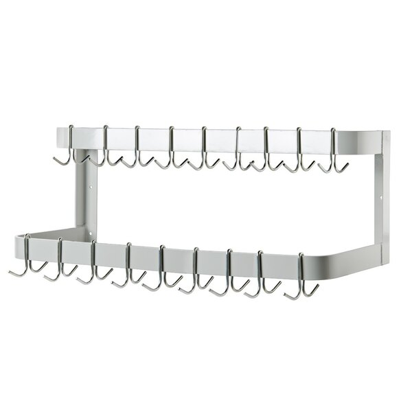 A white powder coated metal wall mounted rack with two rows of double prong hooks.