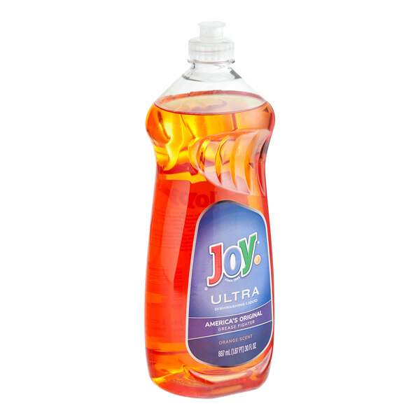 A plastic container of Joy Ultra orange scented dishwashing liquid.