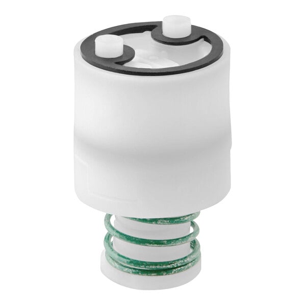 A white Elkay valve regulator with a green spring and plug.