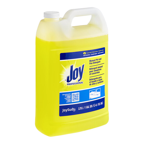A yellow plastic jug of JoySuds liquid dishwashing detergent.
