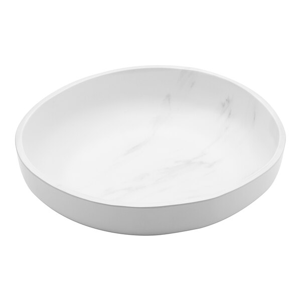 A white bowl with a marble patterned surface.