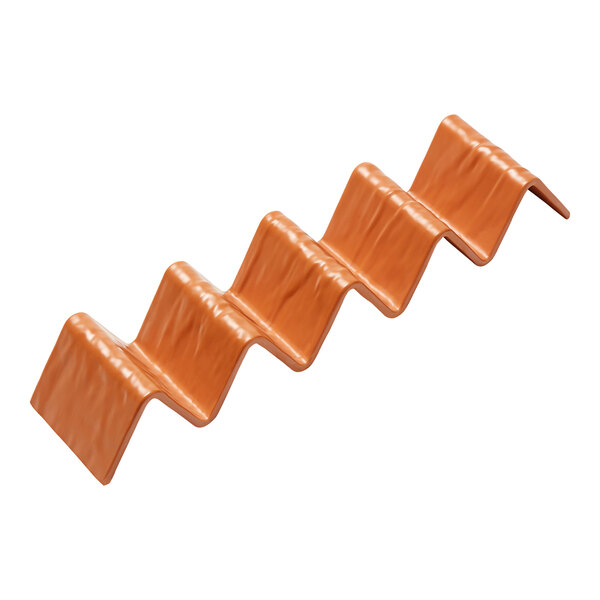 An orange plastic American Metalcraft taco holder with 4 or 5 compartments.