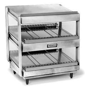 A stainless steel Nemco countertop food warmer with two slanted shelves holding trays.