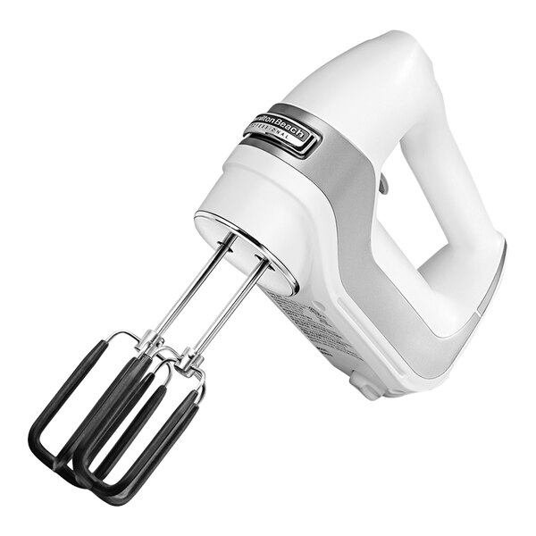 A white and silver Hamilton Beach hand mixer with a whisk attachment.