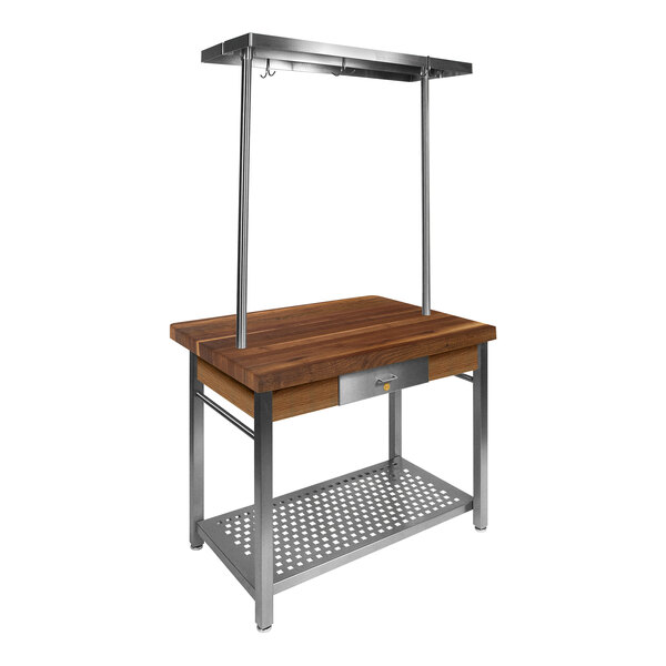 A wooden work table with a metal shelf.