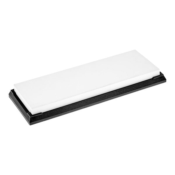 A white rectangular glass sharpening stone with a black base.
