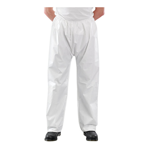 An Ansell AlphaTec white microporous trousers worn by a person.