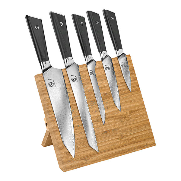 A Mercer Culinary Damascus knife set on a wooden block.