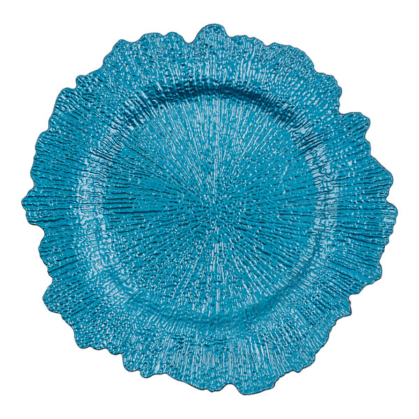 An American Atelier cobalt blue charger plate with a large scalloped edge and rippled design.