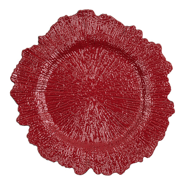 An American Atelier red plastic charger plate with a large, circular scalloped design.