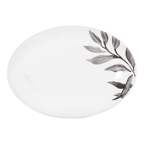 A white oval Cal-Mil melamine platter with a black and grey floral design.