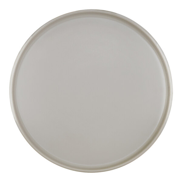 A Cal-Mil Hudson white melamine plate with a raised rim.