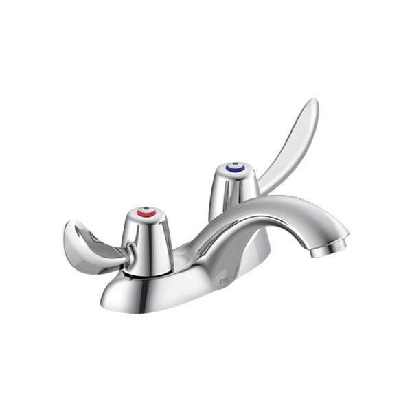 A close-up of a silver Delta deck-mount lavatory faucet with hooded blade handles.