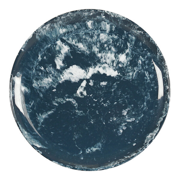 A Cal-Mil blue and white melamine plate with a planet in the middle.
