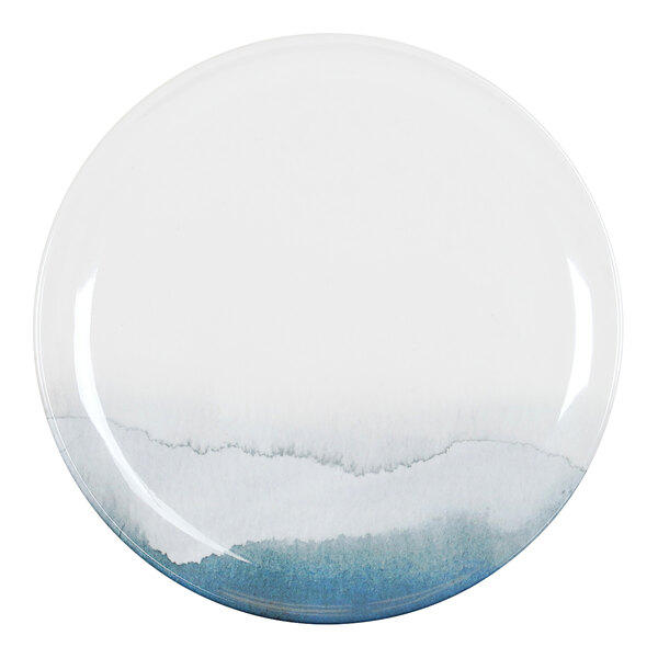 A white Cal-Mil melamine plate with blue and white watercolor designs.