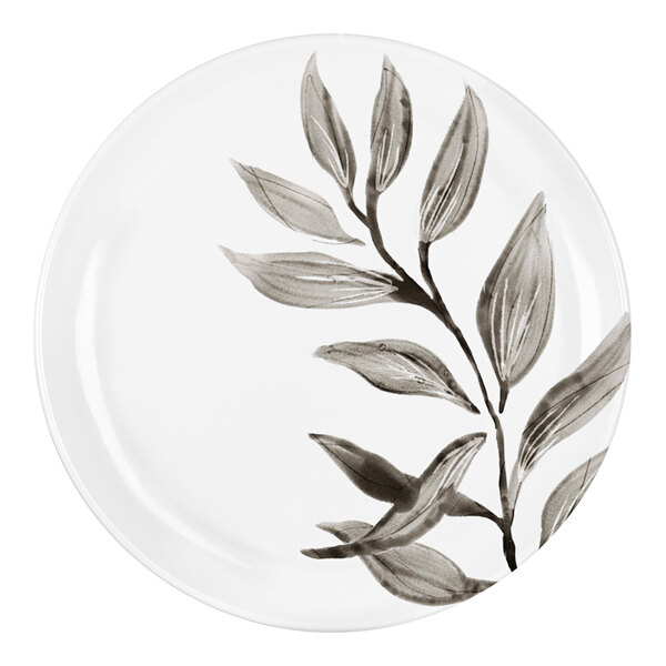 A white Cal-Mil melamine plate with a black and white leaf design.