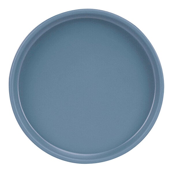 A close-up of a Cal-Mil Hudson stone blue melamine plate with a raised rim.