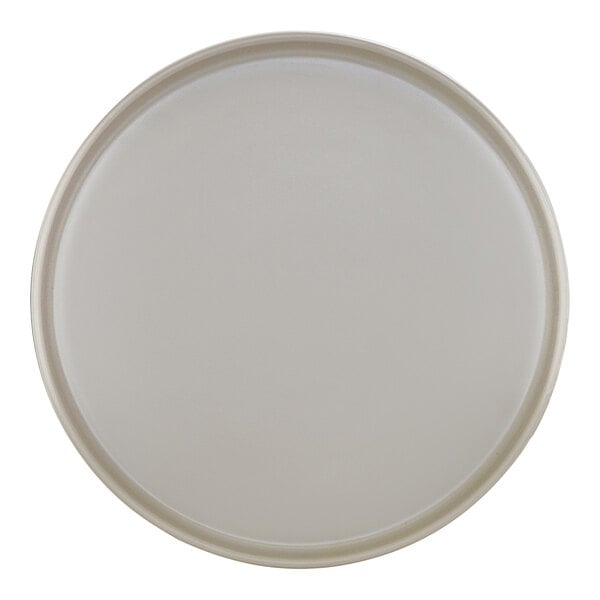 A white Cal-Mil melamine plate with a raised rim.