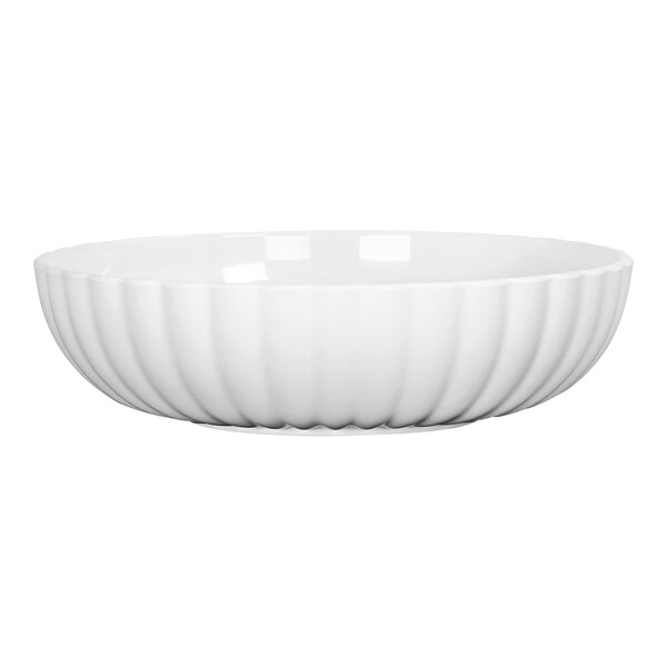 A close up of a white Cal-Mil melamine bowl with a curved design on the rim.