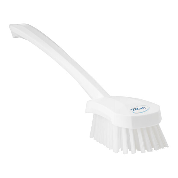 A white Vikan washing brush with a handle.