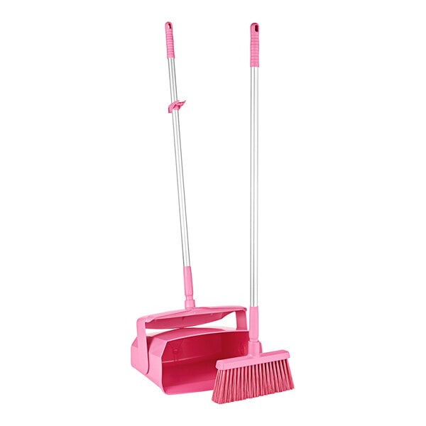 A pink Remco dustpan and broom set.
