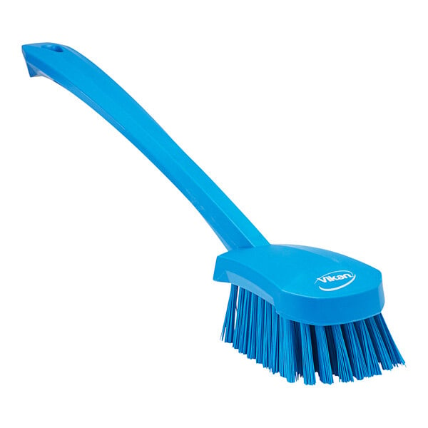 A blue Vikan washing brush with a long handle.