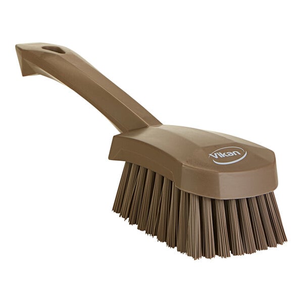 A brown Vikan washing brush with a handle.