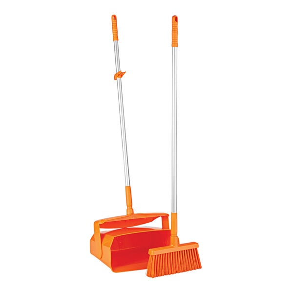 A long orange and white Remco lobby broom and dustpan set.