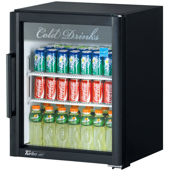 A black Turbo Air countertop display refrigerator with drinks inside.