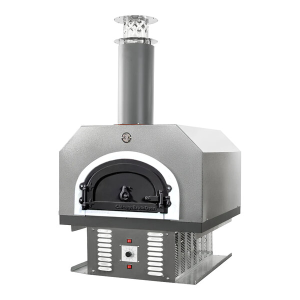 A Chicago Brick Oven silver vein hybrid wood and liquid propane gas-fired countertop pizza oven with a grey brick exterior and chimney.
