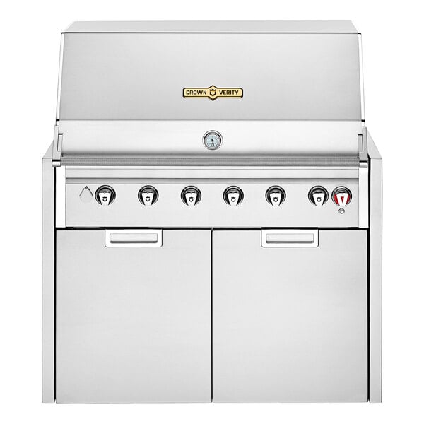 A stainless steel Crown Verity outdoor grill with knobs and drawers.