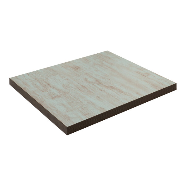 A close-up of an American Tables & Seating square laminate table top with a light blue wood grain finish.