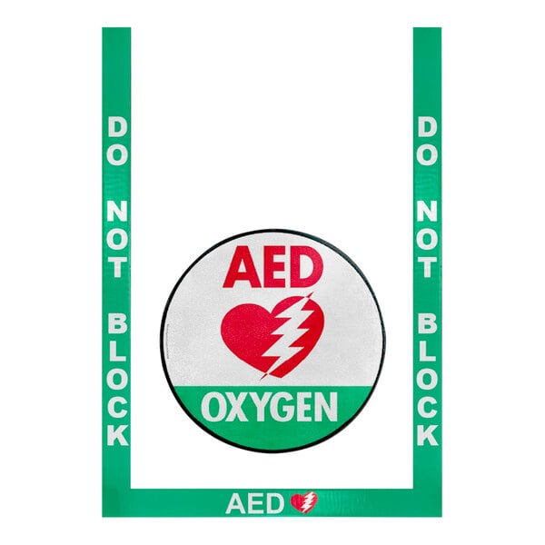 A white sign with green and red text reading "Do Not Block AED Oxygen" and a heart.